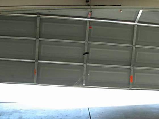 Garage door sitting crooked and off track
