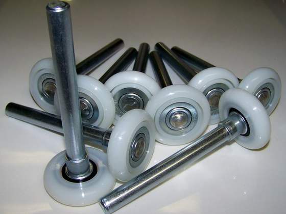Garage door rollers and hinge hardware